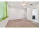 Carpeted bedroom featuring a ceiling fan, recessed lighting, and an ensuite bathroom at 17596 Terrazzo Way, Land O Lakes, FL 34638