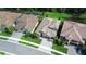 Aerial view showcasing paver driveway leading to a luxury homes in a well manicured subdivision at 21807 Amelia Rose Way, Land O Lakes, FL 34637