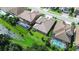 Aerial view of a luxury home with a screened pool and well-maintained landscaping in a suburban neighborhood at 21807 Amelia Rose Way, Land O Lakes, FL 34637