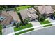 Aerial view showcasing paver driveway leading to luxury homes in a well manicured subdivision at 21807 Amelia Rose Way, Land O Lakes, FL 34637
