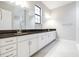 Bathroom featuring double vanity, granite counters, and modern fixtures at 21807 Amelia Rose Way, Land O Lakes, FL 34637