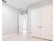 Bedroom featuring double door closet, a window, and neutral walls at 21807 Amelia Rose Way, Land O Lakes, FL 34637