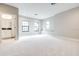 Bonus room featuring soft carpet, natural light and neutral paint at 21807 Amelia Rose Way, Land O Lakes, FL 34637