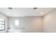 Bonus room with natural light and neutral walls at 21807 Amelia Rose Way, Land O Lakes, FL 34637