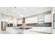 Modern kitchen with granite counters, stainless steel appliances and pendant lighting at 21807 Amelia Rose Way, Land O Lakes, FL 34637
