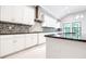 Close up of kitchen with stainless steel appliances and granite countertop at 21807 Amelia Rose Way, Land O Lakes, FL 34637