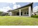 Expansive covered patio perfect for outdoor living with views of the lush backyard and pool at 21807 Amelia Rose Way, Land O Lakes, FL 34637