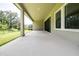 Spacious covered patio perfect for outdoor entertaining featuring concrete floor and natural views at 21807 Amelia Rose Way, Land O Lakes, FL 34637
