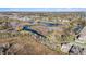An aerial view showcasing community pond and nearby walking trails at 22990 Scaglione Dr, Lutz, FL 33549