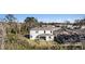 View of the back of the home with a small yard, patio and screened in porch at 22990 Scaglione Dr, Lutz, FL 33549