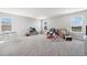Large bonus room with neutral colored carpet with plenty of space to play and relax at 22990 Scaglione Dr, Lutz, FL 33549