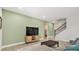 Living room with tv and wooden cabinet below at 22990 Scaglione Dr, Lutz, FL 33549