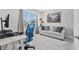 This light filled home office features a desk, chair and relaxing seating space at 22990 Scaglione Dr, Lutz, FL 33549