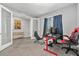 Bright office space with french doors, designed for work, complete with desk setups and modern furnishings at 22990 Scaglione Dr, Lutz, FL 33549
