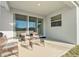 Cozy covered patio with comfortable seating, perfect for relaxing or entertaining outdoors at 22990 Scaglione Dr, Lutz, FL 33549