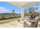 Relaxing covered patio with open views, ideal for enjoying the natural surroundings at 22990 Scaglione Dr, Lutz, FL 33549