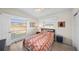 Bedroom featuring wood floors, bright windows, and modern furniture at 2905 Bay St, Sarasota, FL 34237