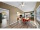 Sunroom turned dining room with modern chairs, wood floors, and lots of bright natural light at 2905 Bay St, Sarasota, FL 34237
