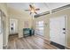 Inviting entryway featuring wood floors, high ceilings, natural light and a lovely blue console table at 2905 Bay St, Sarasota, FL 34237