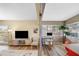 Open living room and office space with wood floors, modern furniture, and bright natural light at 2905 Bay St, Sarasota, FL 34237