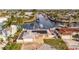 Waterfront home showcasing solar panels, lush landscaping and canal access at 3939 Rudder Way, New Port Richey, FL 34652