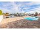 Backyard featuring in-ground pool, waterfront views, and a paved patio at 3939 Rudder Way, New Port Richey, FL 34652