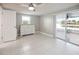 Bright bedroom with white furniture and sliding glass doors to the screened-in lanai at 3939 Rudder Way, New Port Richey, FL 34652
