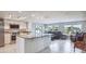 Modern kitchen design with an island, stainless steel appliances, and lots of natural light at 3939 Rudder Way, New Port Richey, FL 34652
