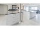 Spacious kitchen featuring stainless steel appliances, white cabinets and sleek countertops at 3939 Rudder Way, New Port Richey, FL 34652