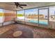 Covered patio with outdoor seating, in-ground pool, and waterfront views at 3939 Rudder Way, New Port Richey, FL 34652