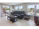 Cozy living room with leather seating and views of the pool and canal at 3939 Rudder Way, New Port Richey, FL 34652