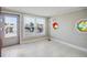 Bright room featuring tiled floors, a boat view, and unique windows at 3939 Rudder Way, New Port Richey, FL 34652