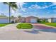 Charming single-Gathering home with a one-car garage, long driveway and a well-maintained front yard at 5033 Blue Heron Dr, New Port Richey, FL 34652