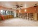 Living room before remodel with ceiling fan and natural light at 5033 Blue Heron Dr, New Port Richey, FL 34652