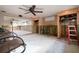 Empty living room awaiting remodel with ceiling fan and natural light at 5033 Blue Heron Dr, New Port Richey, FL 34652