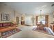 Spacious living and dining area featuring neutral decor, with a leather sofa and natural wood dining set at 5327 N Cranberry Blvd, North Port, FL 34286