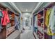 Spacious walk-in closet with custom shelves and drawers provides ample storage space at 6 Belleview Blvd # 203, Belleair, FL 33756