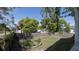 Spacious backyard featuring a wooden fence and garden bed at 602 Nw Drane St, Plant City, FL 33563