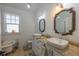 Bathroom featuring double sinks, granite countertop and classic, vintage style tub at 602 Nw Drane St, Plant City, FL 33563