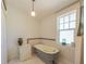 Bathroom featuring a classic clawfoot tub, subway tile and a bright window at 602 Nw Drane St, Plant City, FL 33563