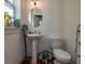 Small bathroom featuring a pedestal sink and toilet at 602 Nw Drane St, Plant City, FL 33563