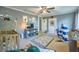 Bedroom featuring stylish decor, a ceiling fan, and carpet at 602 Nw Drane St, Plant City, FL 33563