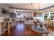 Bright dining space with hardwood floors, island seating, and a decorative chandelier at 602 Nw Drane St, Plant City, FL 33563