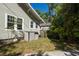 Exterior detail of a home with classic siding and adjacent storage shed at 602 Nw Drane St, Plant City, FL 33563