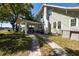 Two-story home with a convenient carport, chimney, and well-manicured lawn at 602 Nw Drane St, Plant City, FL 33563