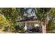 Attractive two-story home with a convenient carport and lush greenery at 602 Nw Drane St, Plant City, FL 33563