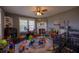 Play room with a fireplace, ceiling fan, and windows to let the light in at 602 Nw Drane St, Plant City, FL 33563