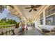 Spacious porch features an outdoor ceiling fan, and ample seating space at 602 Nw Drane St, Plant City, FL 33563