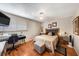 Cozy bedroom featuring a ceiling fan and large window at 6308 Newtown Cir # 8C5, Tampa, FL 33615