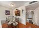 Dining area featuring pass-through to kitchen and front entrance at 6308 Newtown Cir # 8C5, Tampa, FL 33615